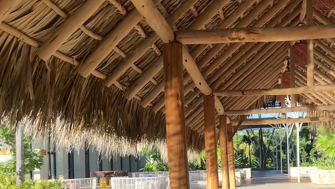 A covered thatched walkway at the W Punta Cana